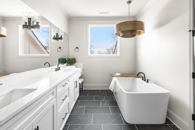 bathroom featuring marble finish floor, visible vents, ornamental molding, a sink, and baseboards