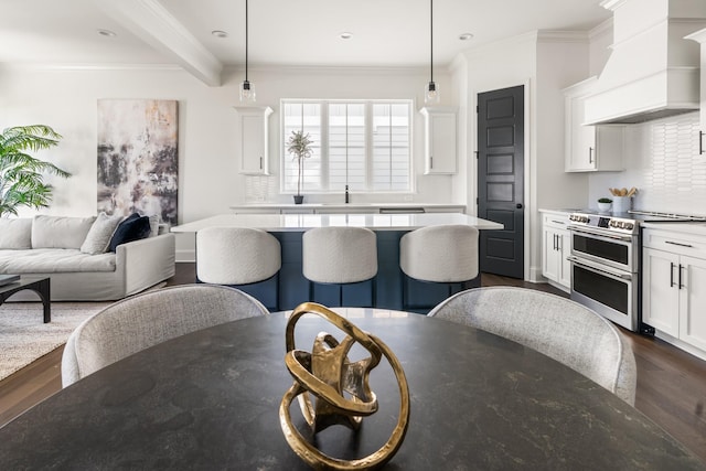 kitchen with white cabinets, dark wood-style flooring, custom exhaust hood, light countertops, and double oven range