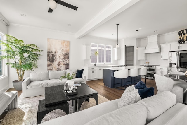 living area with crown molding, ceiling fan, and dark wood-style flooring