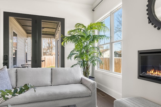 interior space featuring visible vents and a glass covered fireplace