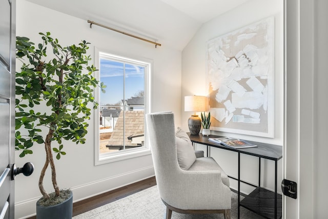 office area with vaulted ceiling, baseboards, and wood finished floors