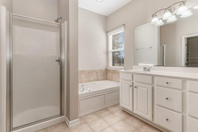 full bathroom featuring a stall shower, tile patterned flooring, a bath, and vanity