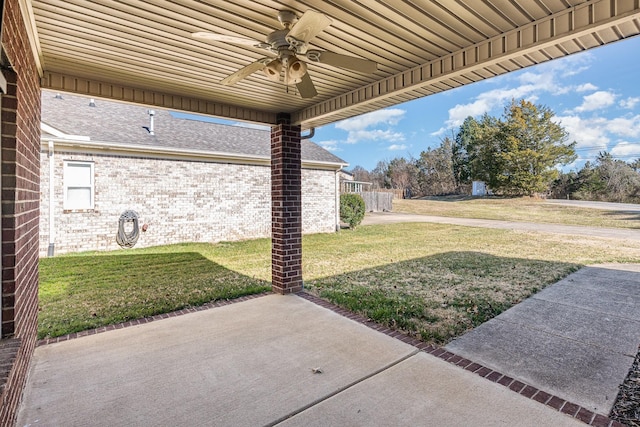 view of yard with a patio area and ceiling fan