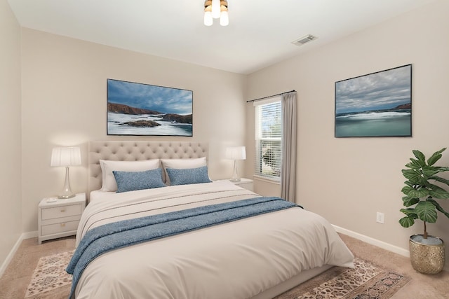 bedroom with carpet flooring, visible vents, and baseboards