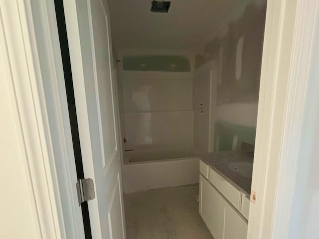 full bath with a bathing tub, walk in shower, and vanity