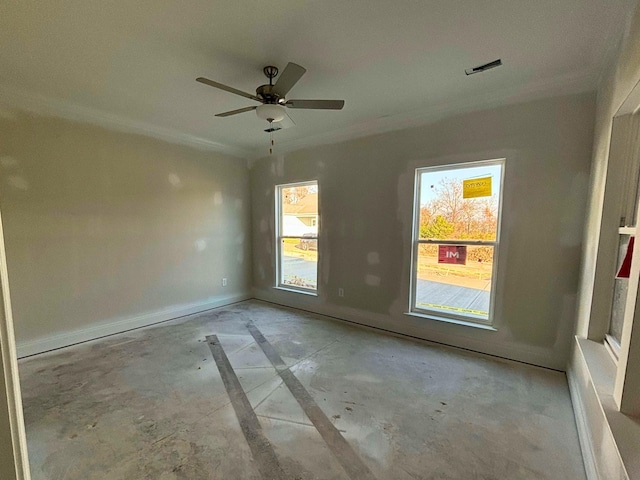 unfurnished room with baseboards, visible vents, and a ceiling fan