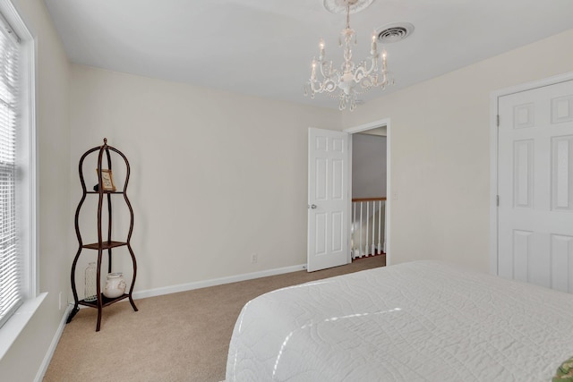 carpeted bedroom with visible vents, baseboards, and multiple windows