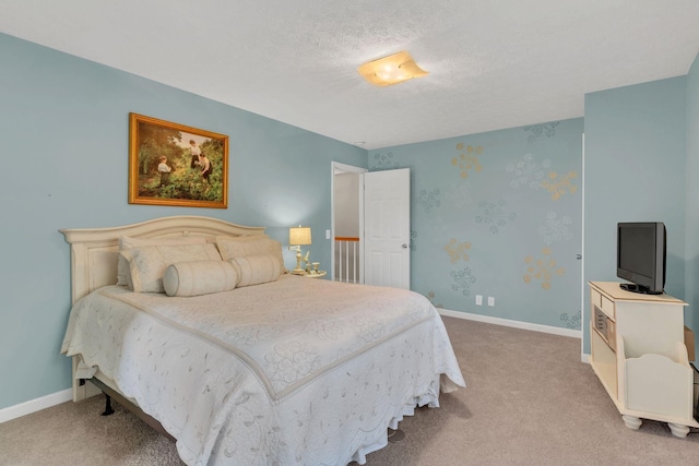 carpeted bedroom with a textured ceiling and baseboards