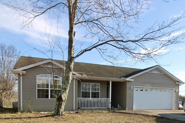 ranch-style home with concrete driveway, a porch, and an attached garage