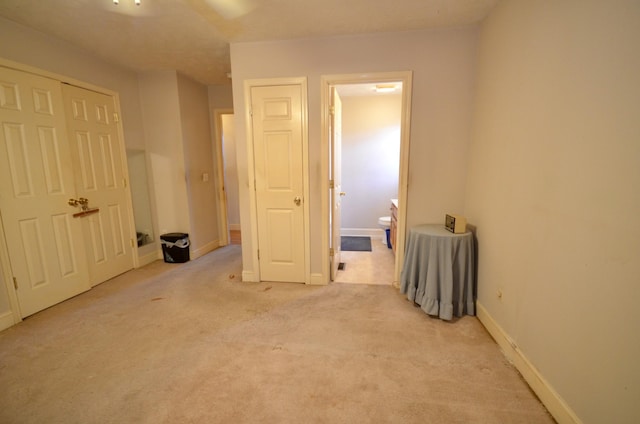 798 Buffalo Valley Rd, Cookeville, TN 38501 - unfurnished bedroom featuring baseboards, ensuite bathroom, and light colored carpet