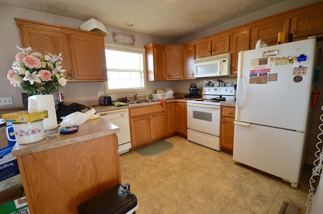 798 Buffalo Valley Rd, Cookeville, TN 38501 - kitchen with white appliances, brown cabinets, light countertops, light floors, and a sink