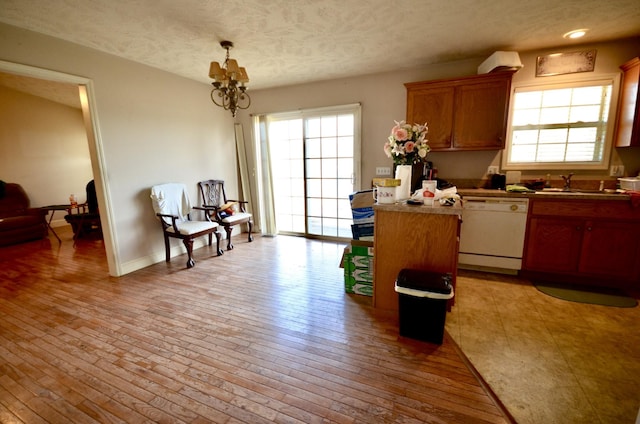 798 Buffalo Valley Rd, Cookeville, TN 38501 - kitchen with a sink, light wood-style floors, dishwasher, and an inviting chandelier