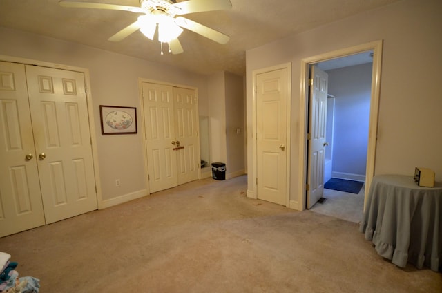 798 Buffalo Valley Rd, Cookeville, TN 38501 - unfurnished bedroom featuring baseboards, ceiling fan, carpet flooring, and multiple closets