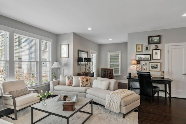 living room with recessed lighting, baseboards, and wood finished floors