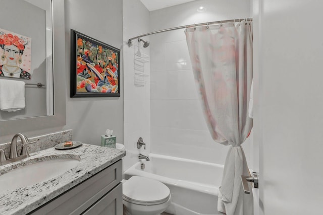 full bathroom with shower / tub combo with curtain, vanity, and toilet