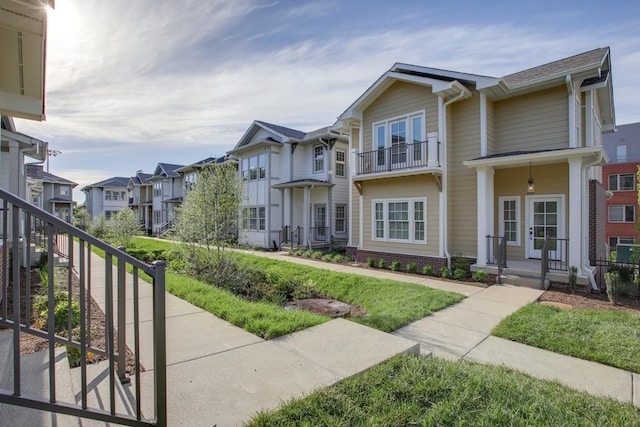 view of front of property with french doors and a residential view