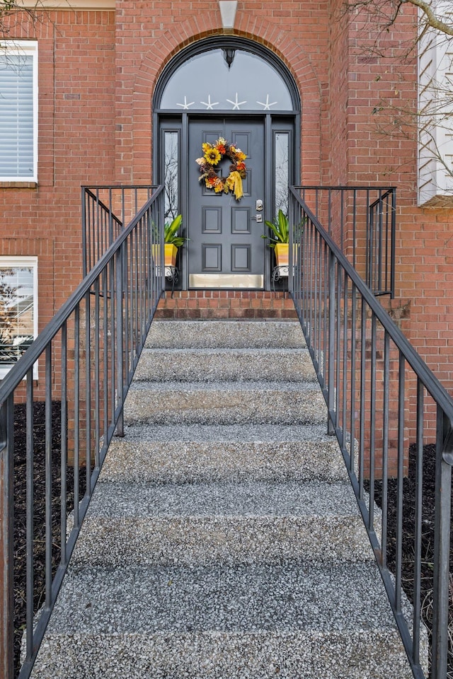 property entrance with brick siding