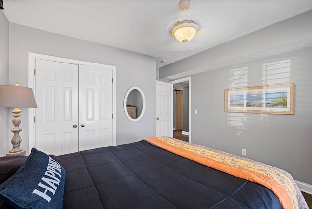 unfurnished bedroom featuring a closet and baseboards