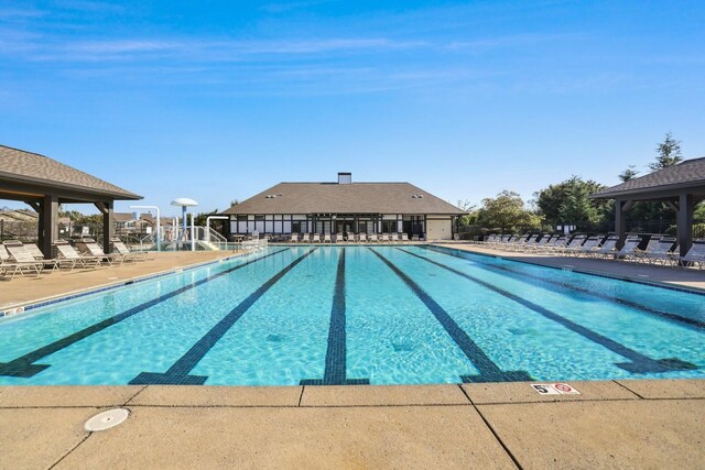 community pool with a patio area