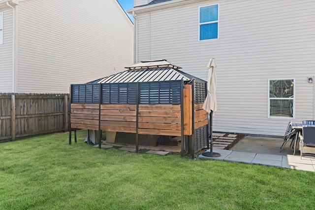 view of yard with fence and a gazebo