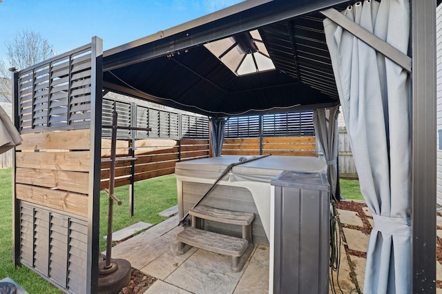 view of patio / terrace with fence and a gazebo