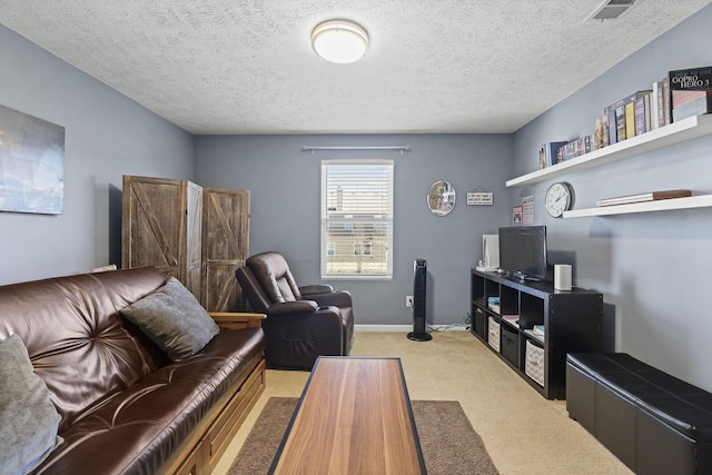 living room featuring visible vents, light colored carpet, a textured ceiling, and baseboards