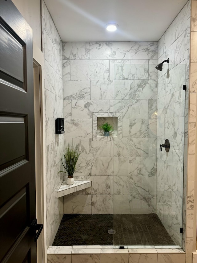 bathroom with a shower stall