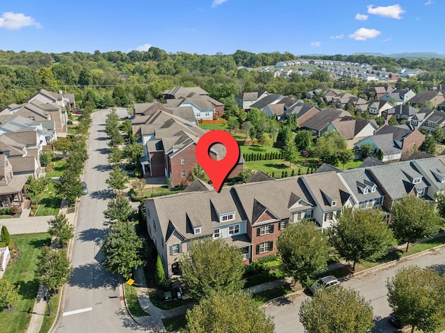 birds eye view of property with a residential view