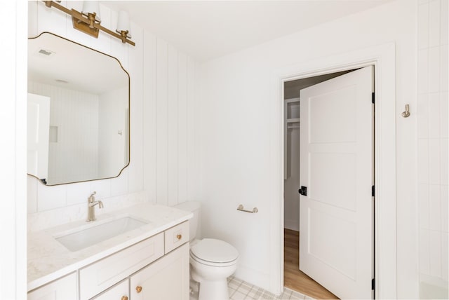 bathroom with vanity and toilet