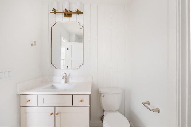 half bath with vanity and toilet