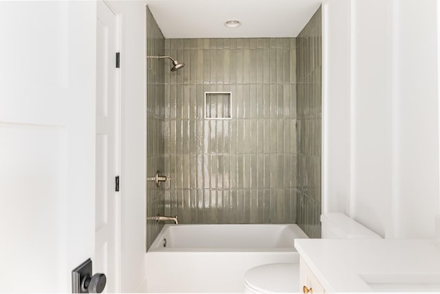 bathroom featuring shower / bath combination, vanity, and toilet