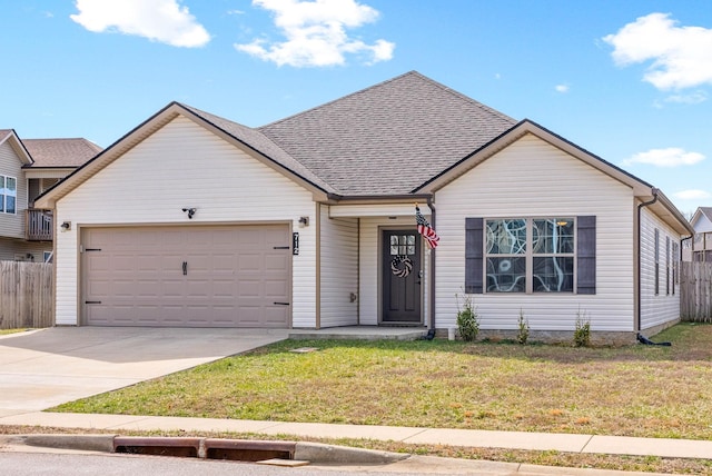 ranch-style home with concrete driveway, roof with shingles, an attached garage, fence, and a front lawn