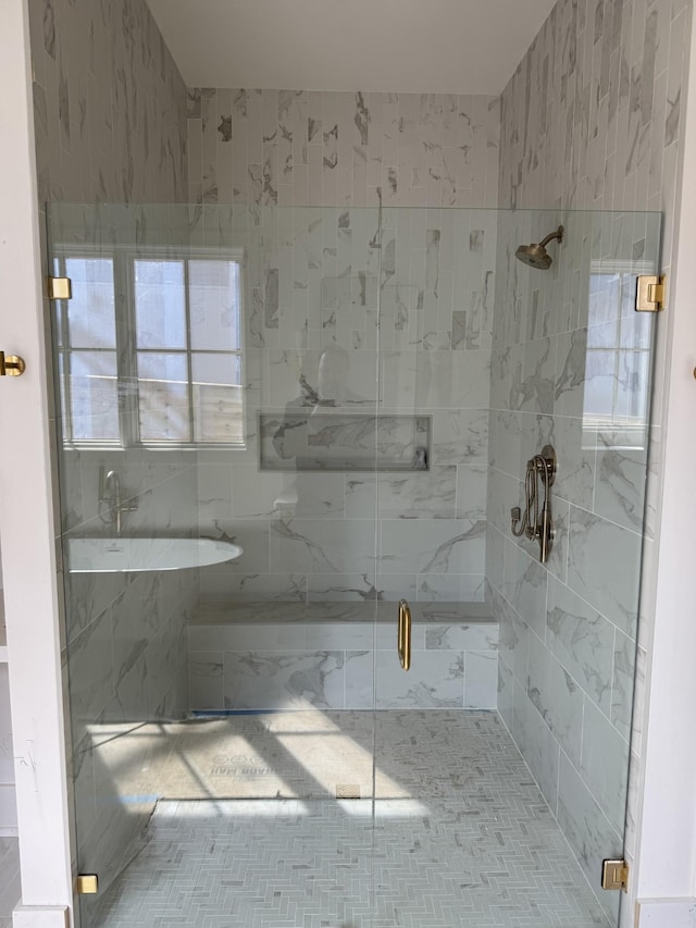 bathroom with a stall shower and a bath