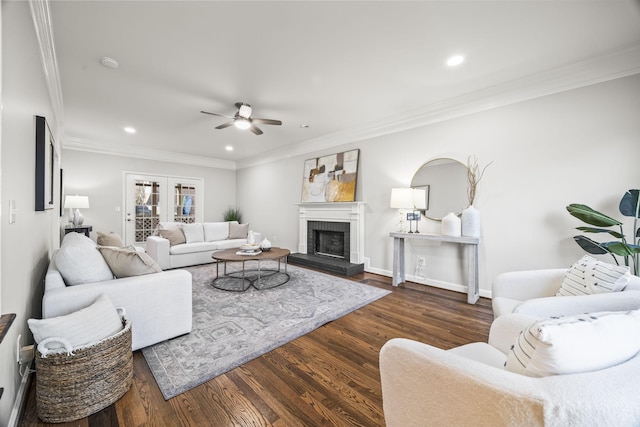 living area featuring a ceiling fan, recessed lighting, wood finished floors, and ornamental molding