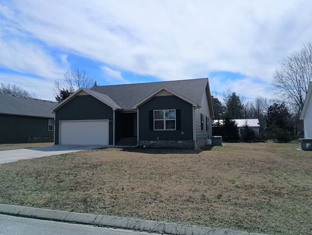 single story home featuring a front lawn, driveway, and an attached garage