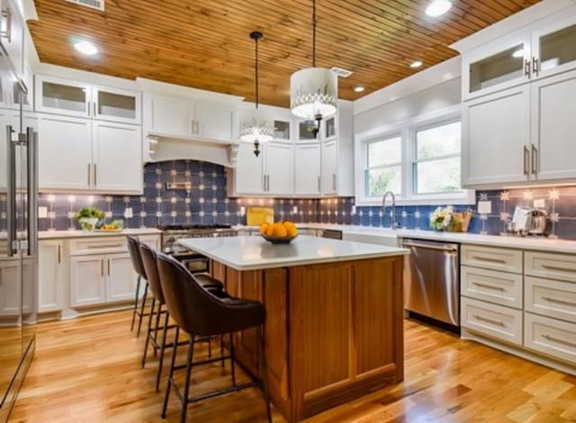 3635 Old Williamsport Rd, Williamsport, TN 38487 - kitchen featuring wood ceiling, light countertops, dishwasher, and a center island