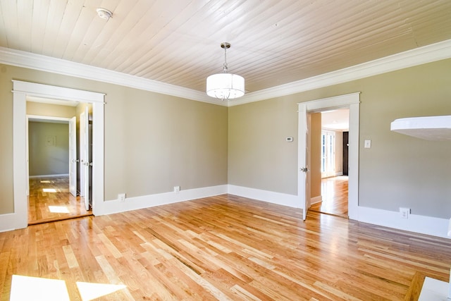 3635 Old Williamsport Rd, Williamsport, TN 38487 - unfurnished room with baseboards, crown molding, a notable chandelier, and light wood finished floors