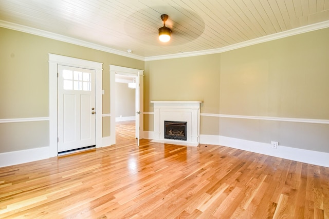 3635 Old Williamsport Rd, Williamsport, TN 38487 - unfurnished living room with ornamental molding, baseboards, light wood-style floors, and a fireplace with flush hearth
