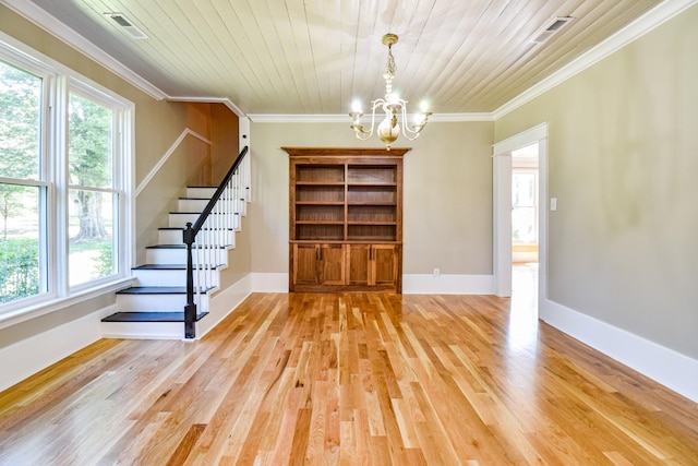3635 Old Williamsport Rd, Williamsport, TN 38487 - interior space with a notable chandelier, crown molding, light wood-type flooring, baseboards, and stairs