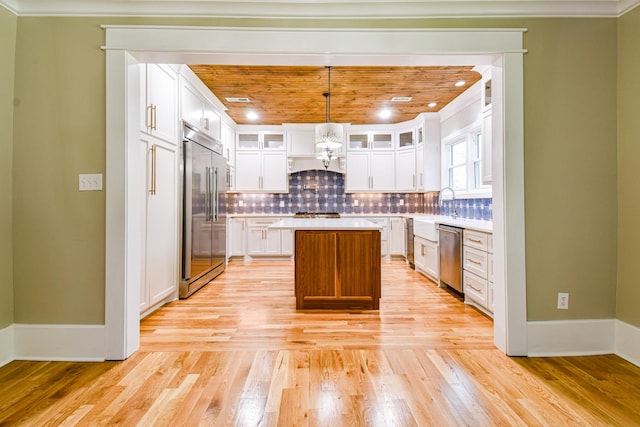 3635 Old Williamsport Rd, Williamsport, TN 38487 - kitchen featuring stainless steel appliances, light countertops, ornamental molding, and tasteful backsplash