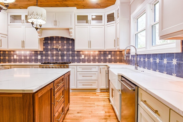 kitchen with white cabinets, glass insert cabinets, decorative backsplash, and dishwasher