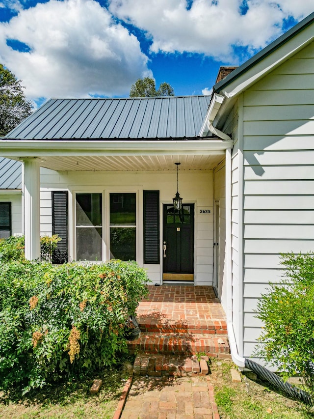 3635 Old Williamsport Rd, Williamsport, TN 38487 - view of exterior entry featuring metal roof and a porch
