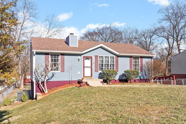 view of front of property featuring a shingled roof, fence, a chimney, and a front lawn