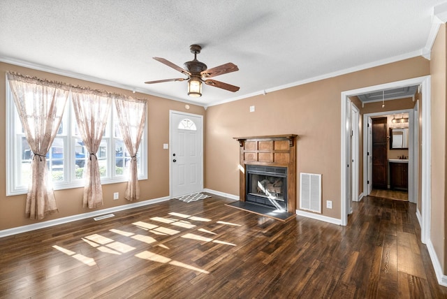 unfurnished living room with baseboards, hardwood / wood-style flooring, visible vents, and attic access