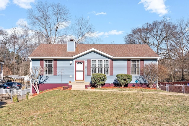 ranch-style house with a shingled roof, a chimney, fence, and a front yard