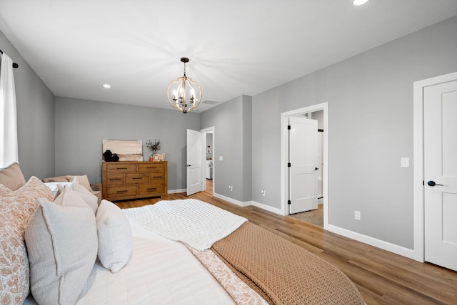 bedroom with recessed lighting, a notable chandelier, baseboards, and wood finished floors