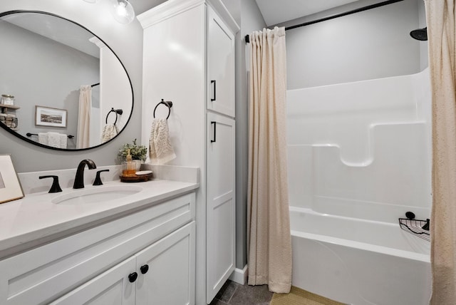 bathroom with shower / bath combo with shower curtain, vanity, and tile patterned floors