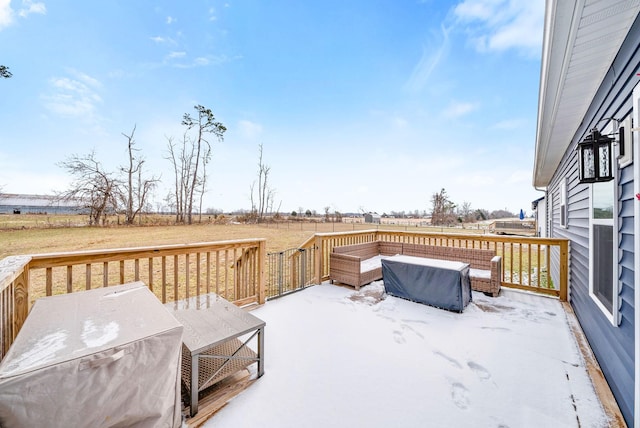 wooden deck featuring a rural view