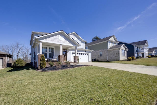 view of front of property featuring brick siding, a porch, an attached garage, a front yard, and driveway