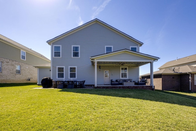 back of house with a patio, a yard, and a ceiling fan